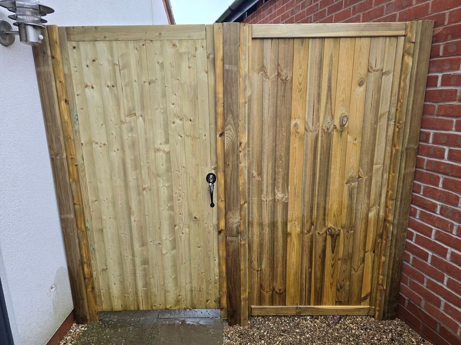 Framed tongue-and-groove garden gate with matching panel