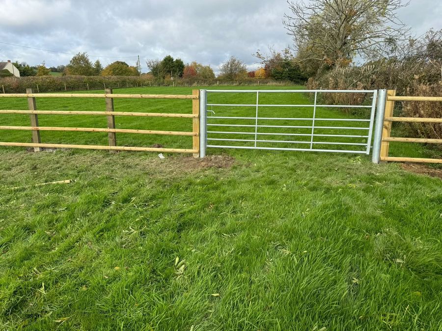Galvanised metal field gate on a paddock entrance
