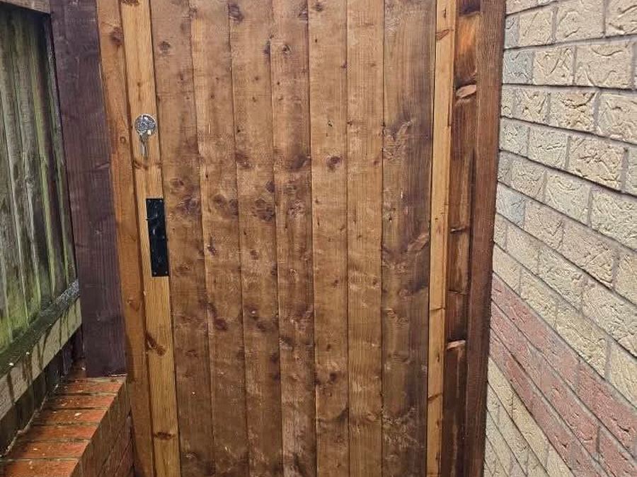 Green welded-mesh security gate