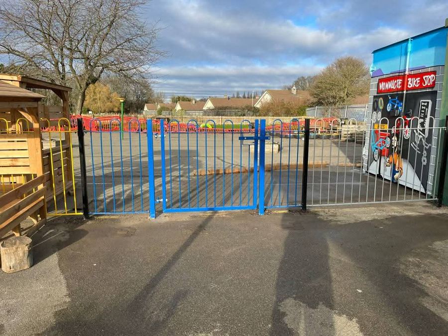 Bow-top metal gates at a school playground